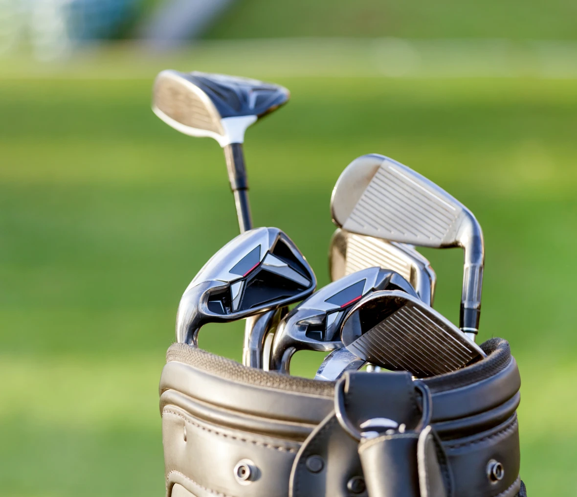 Set of golf clubs on course